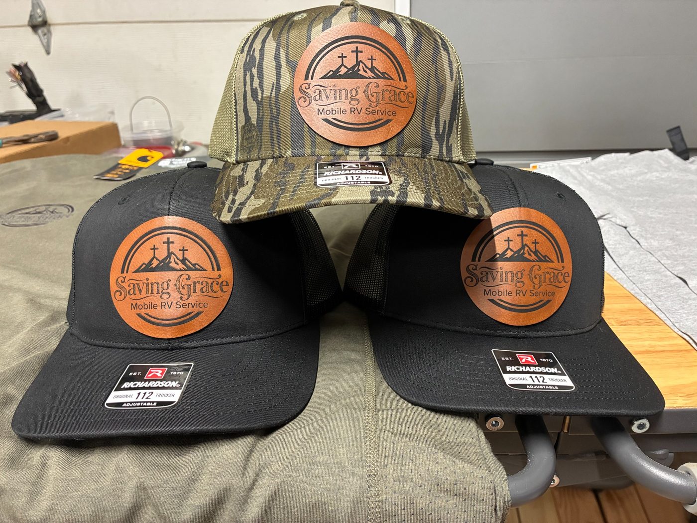 Three custom Saving Grace Mobile RV Service hats